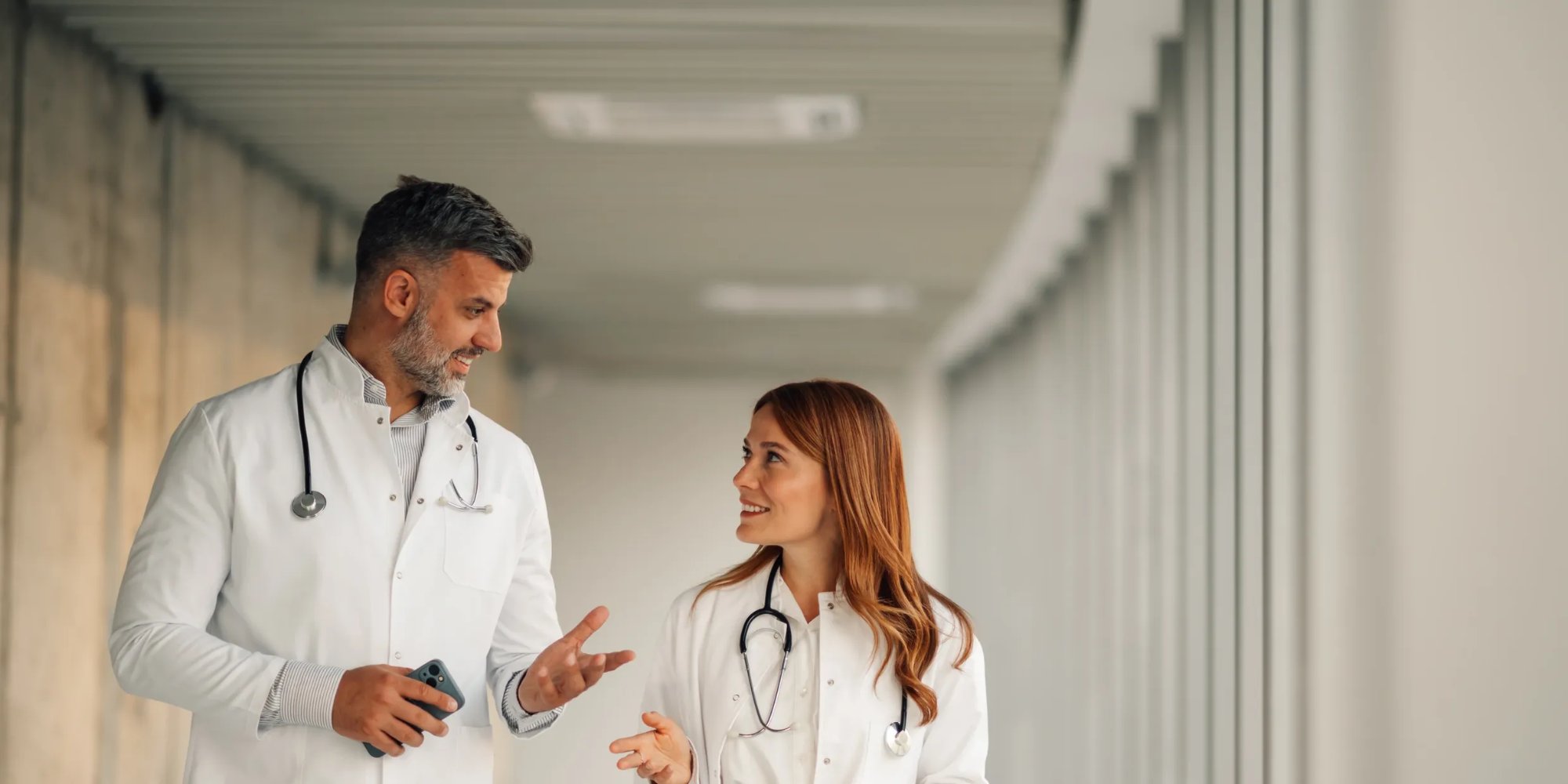 Healthcare professionals in a hospital corridor